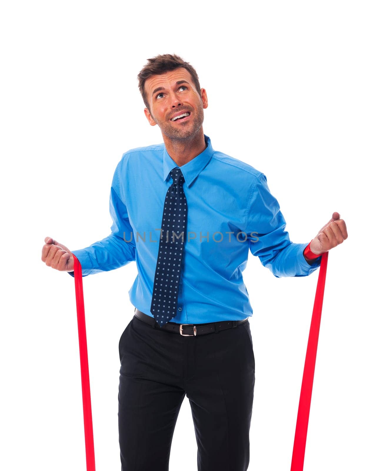 Business man trying free themselves from clutches of corporate
