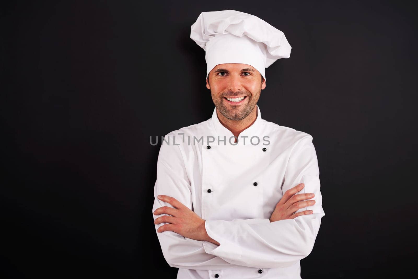 Portrait of smiling chef in uniform