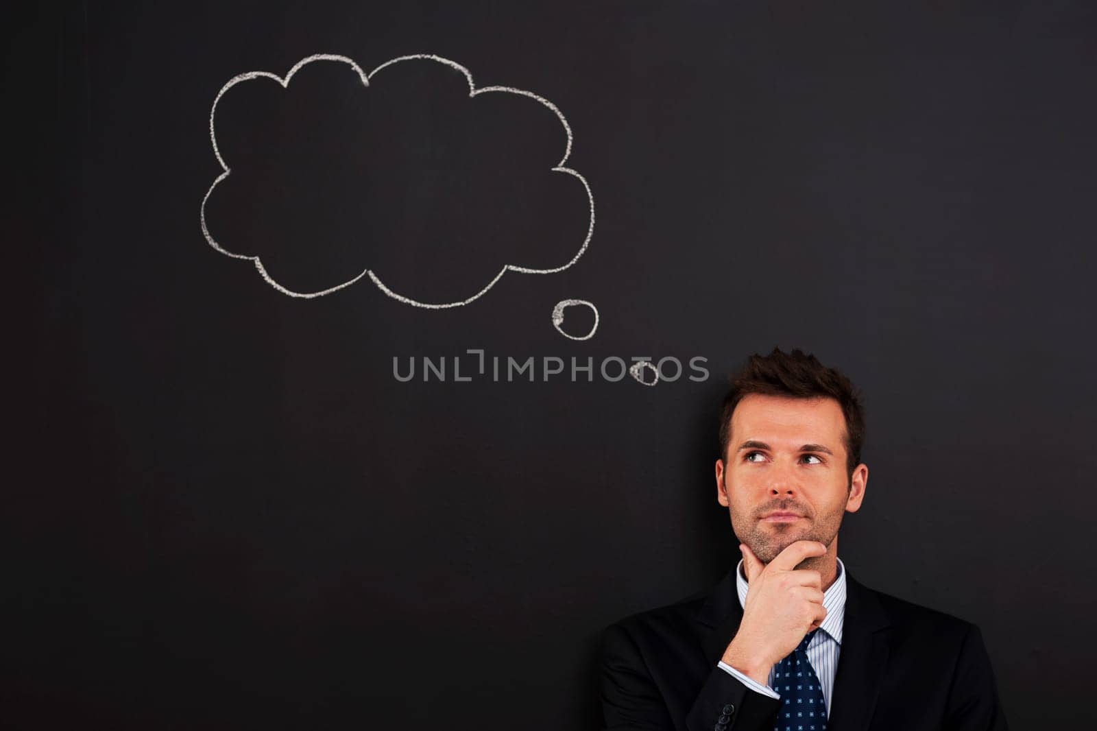 Portrait of pensive and thoughtful businessman