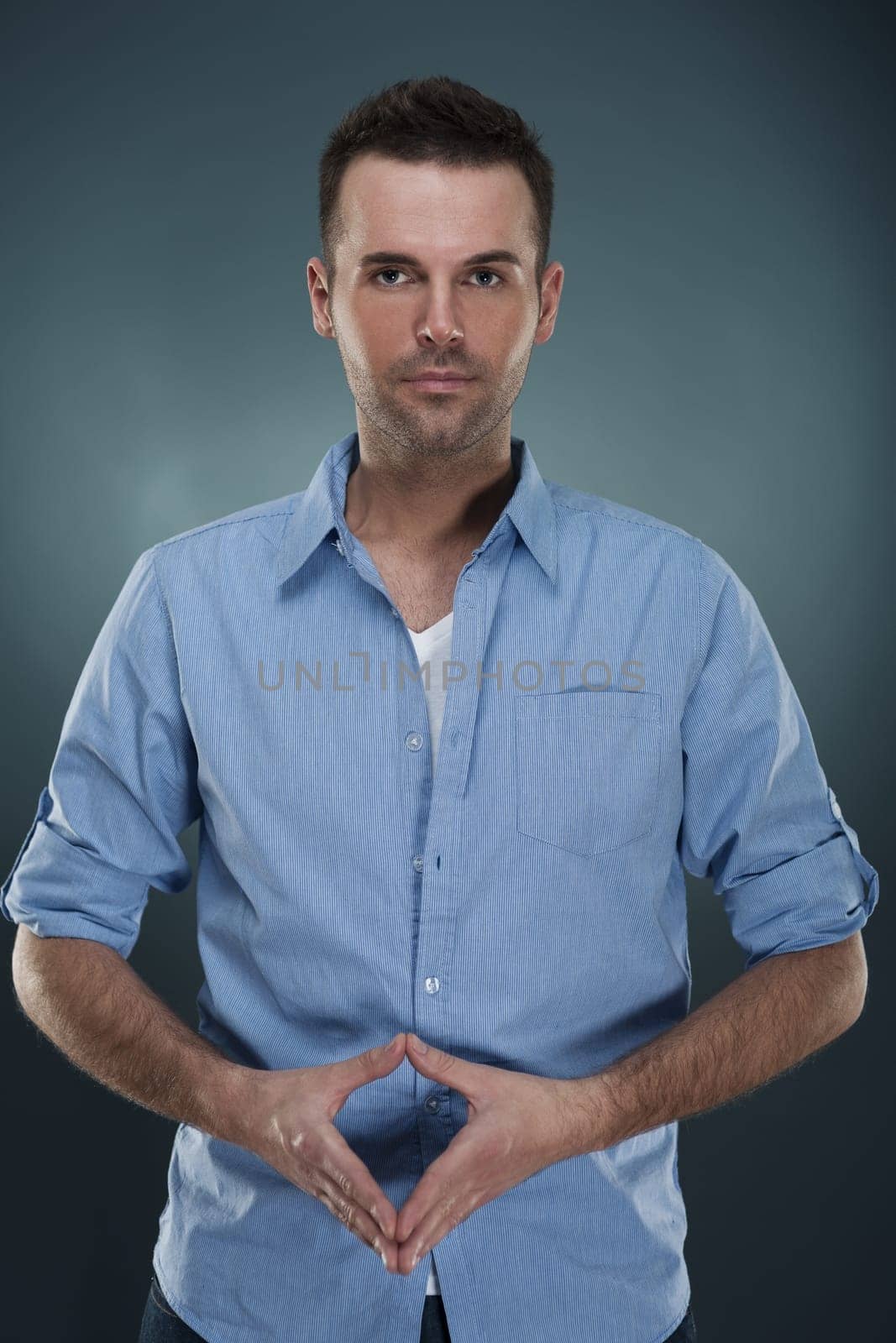 Confident handsome man in blue shirt