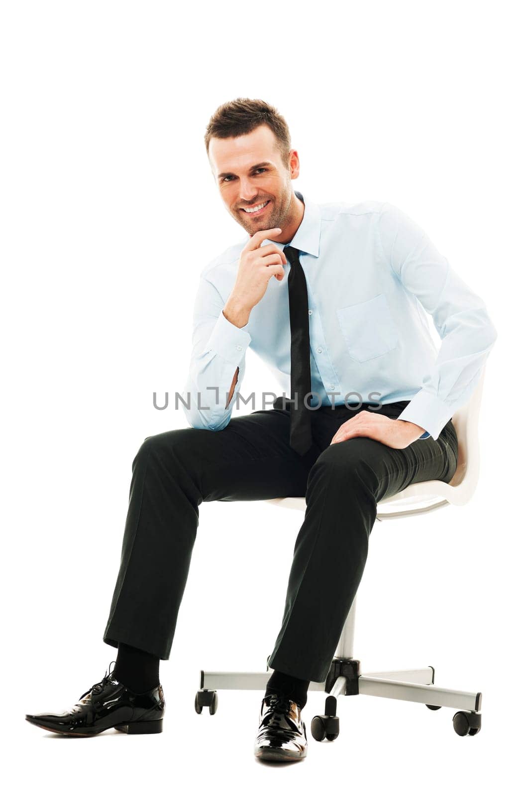 Successful businessman sitting on chair