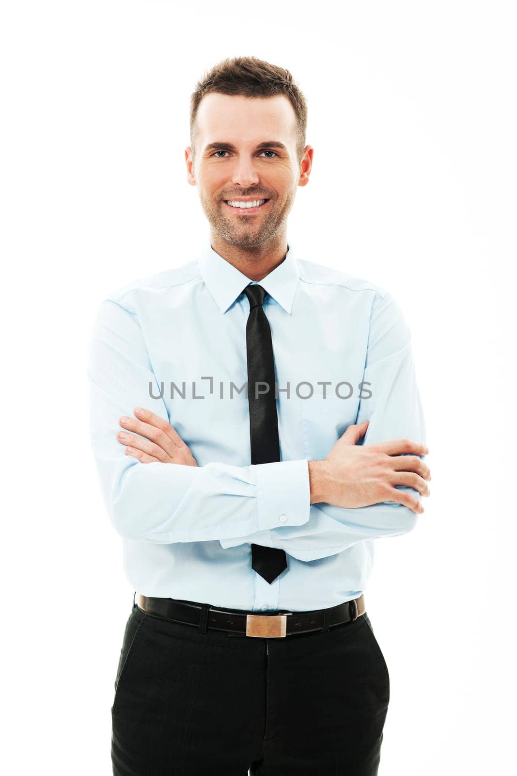 Portrait of smiling businessman with arms crossed