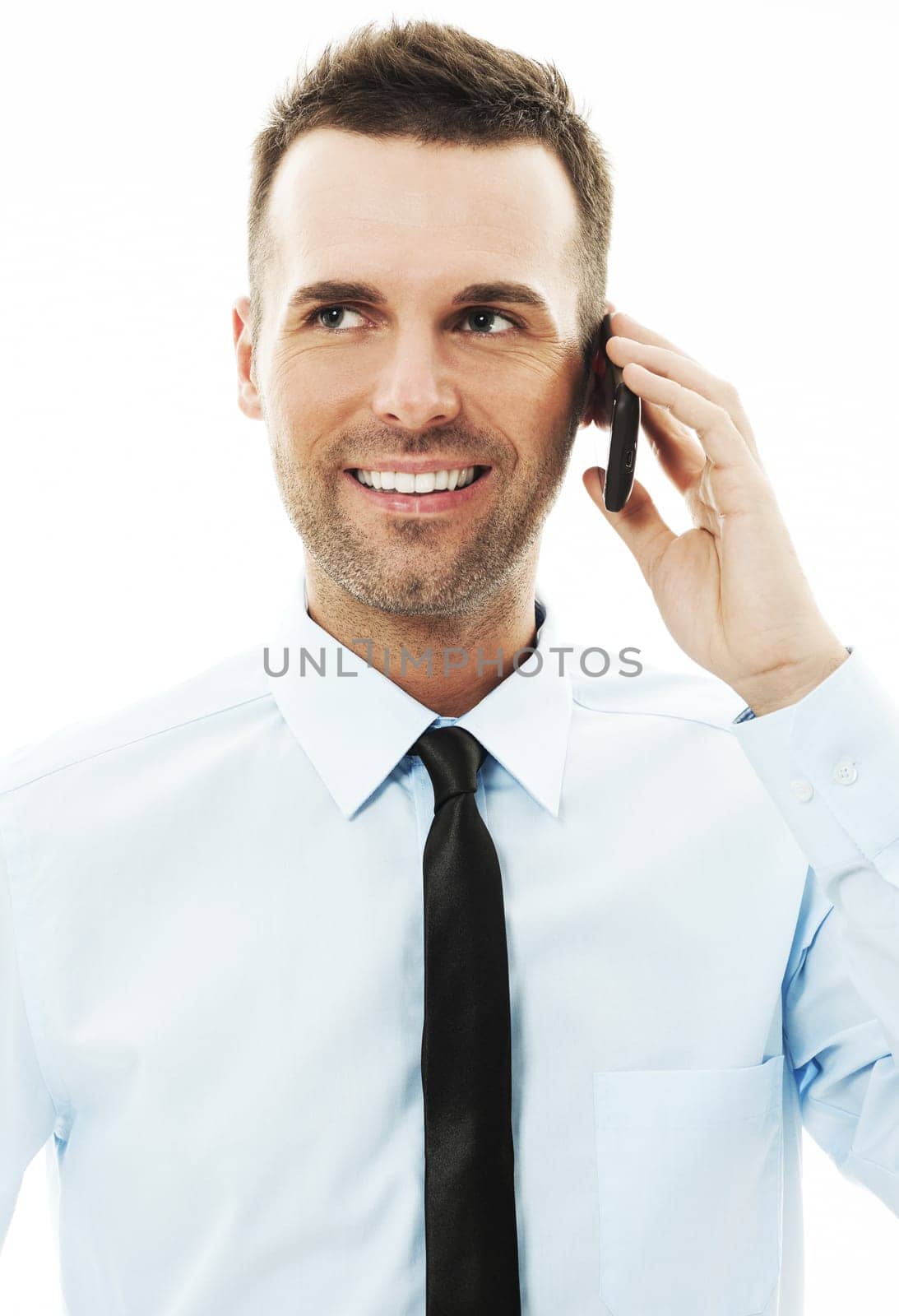 Handsome businessman talking on mobile phone