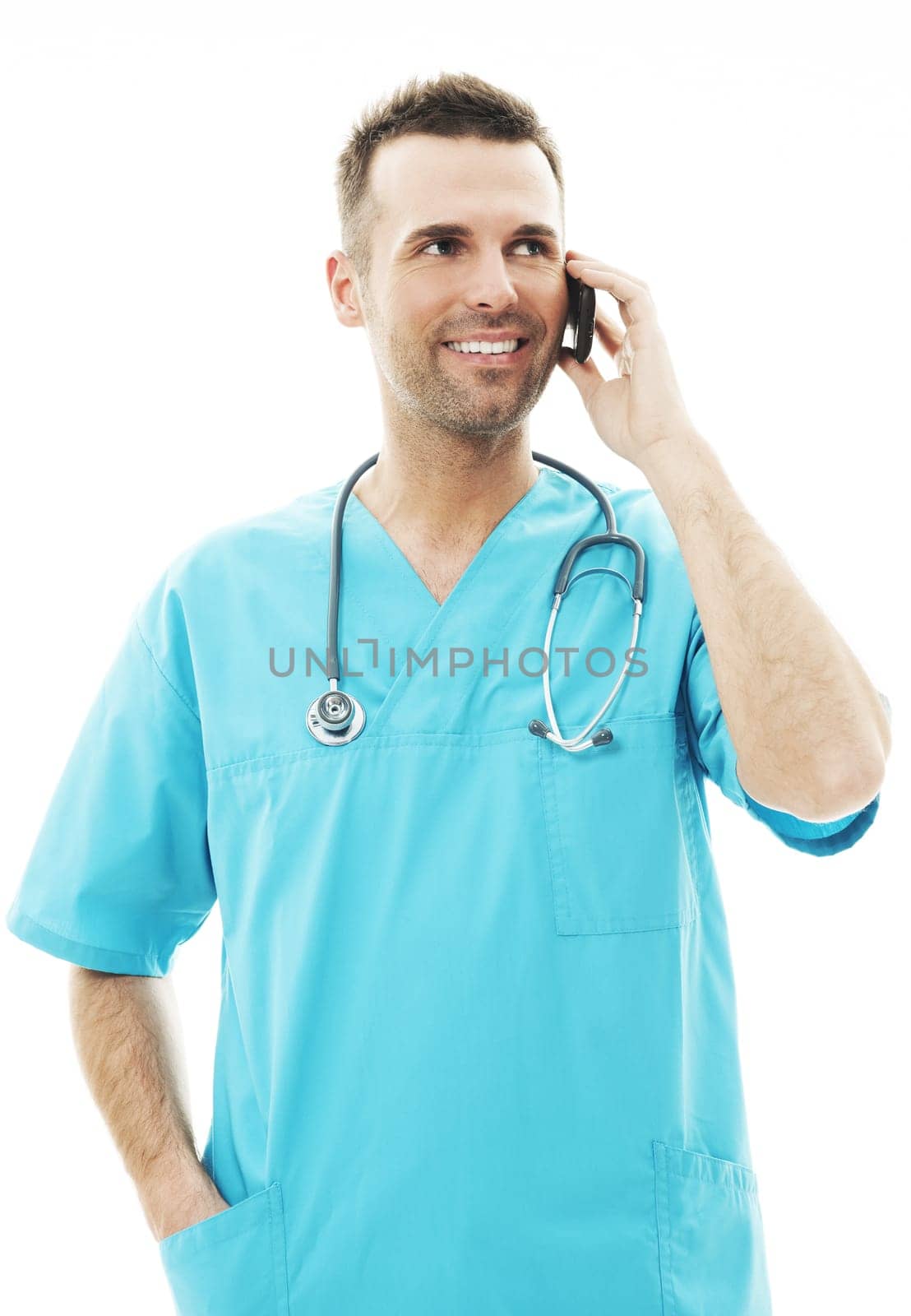 Handsome male surgeon talking on a mobile phone