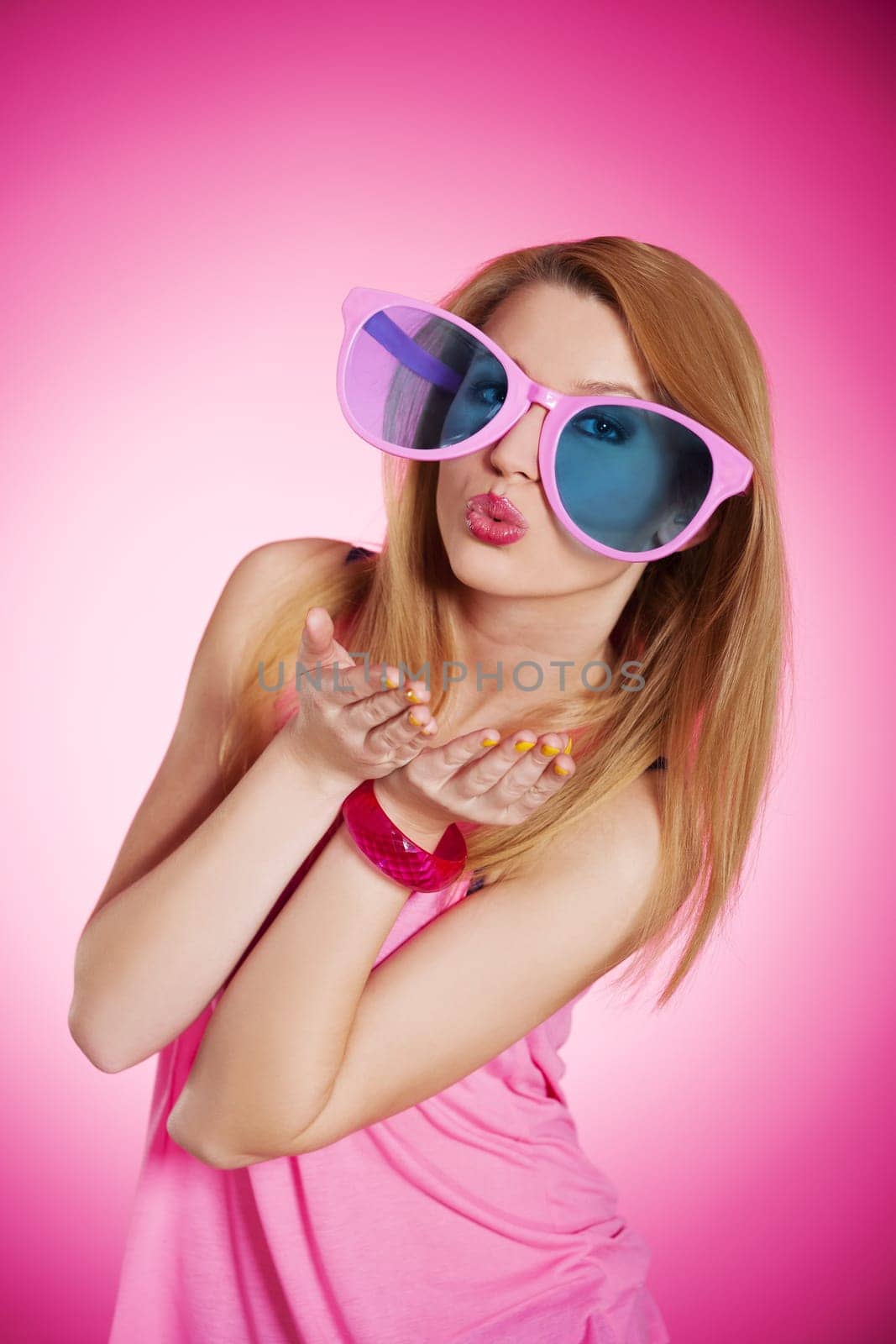 Cheerful woman with oversized sunglasses