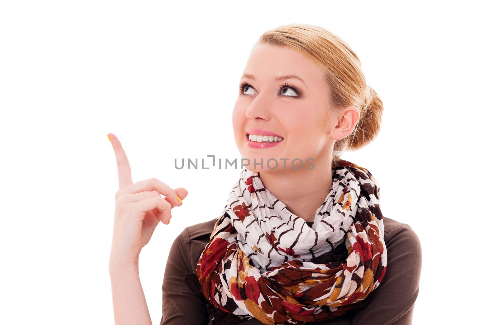 Young blonde woman pointing up