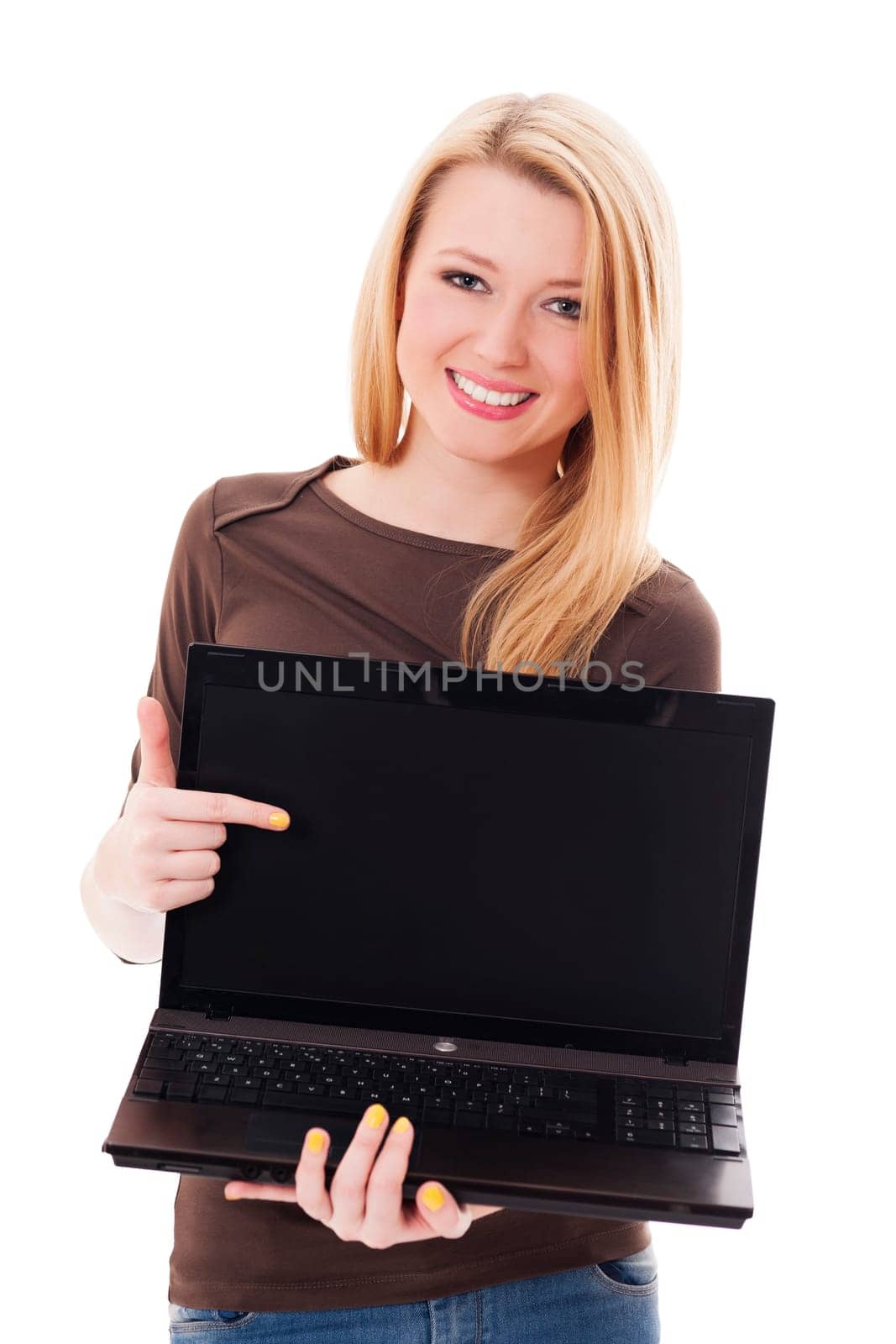 Young blonde woman pointing at her laptop