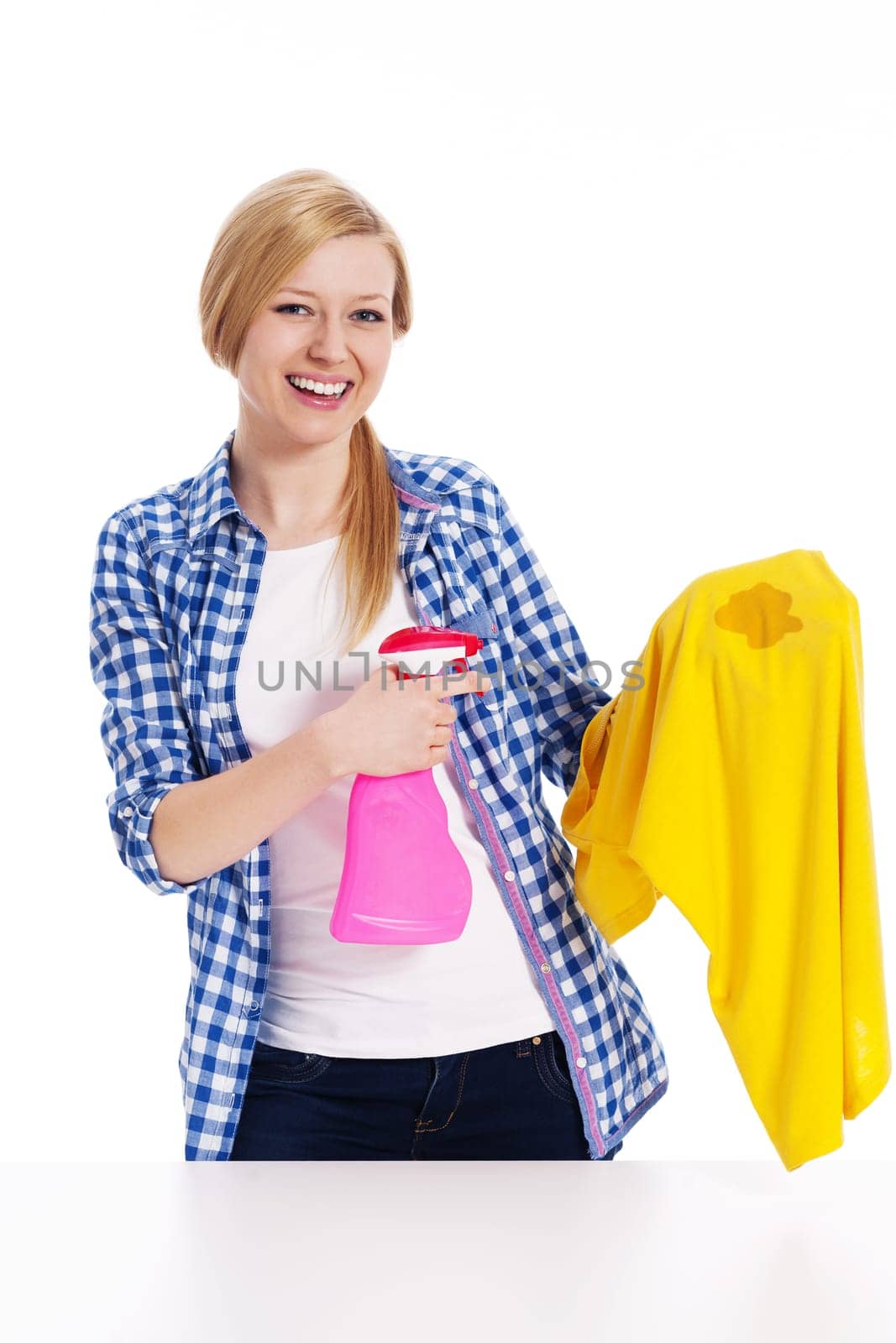 Perfect housewife cleaning the stain with shirts