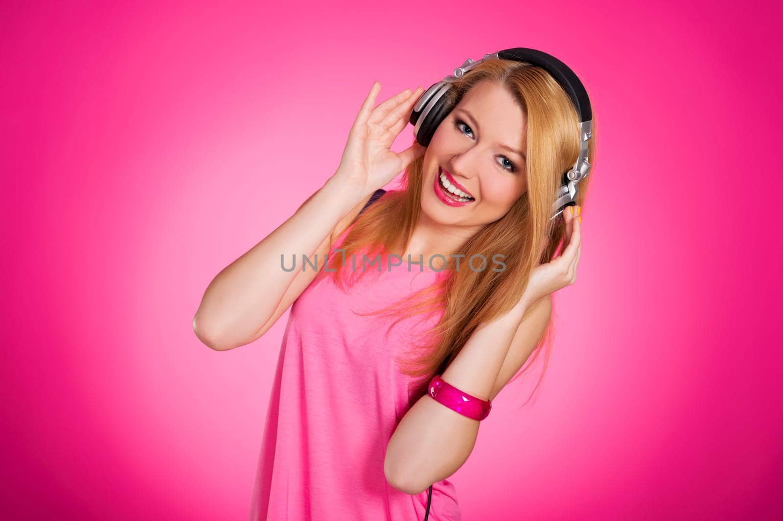 Pink glamour woman listening to music