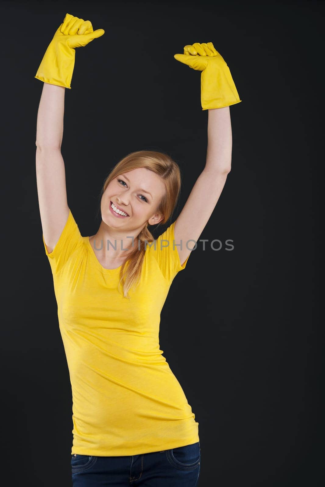 Happy woman with yellow protective glove
