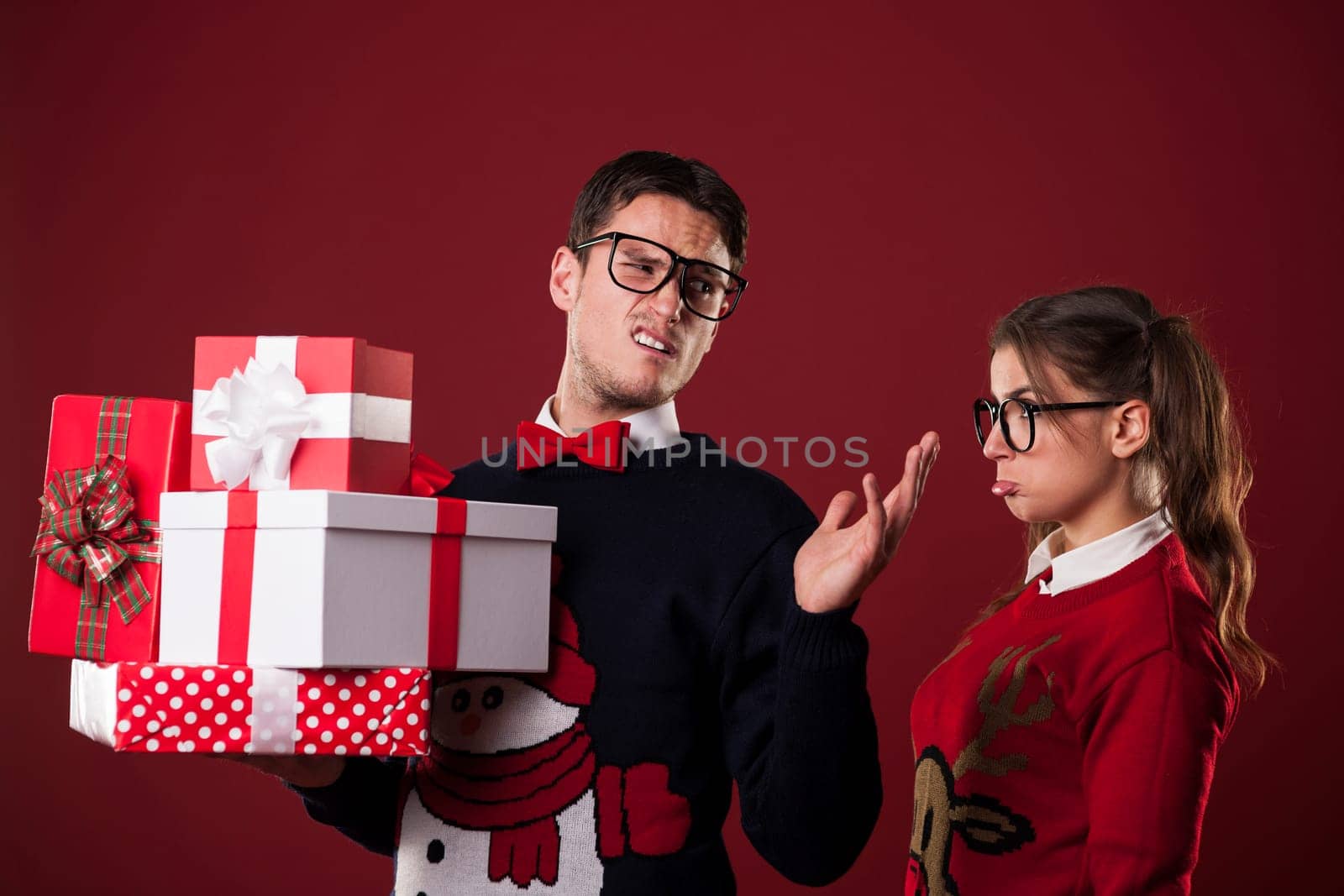 Rude nerdy man with christmas gifts