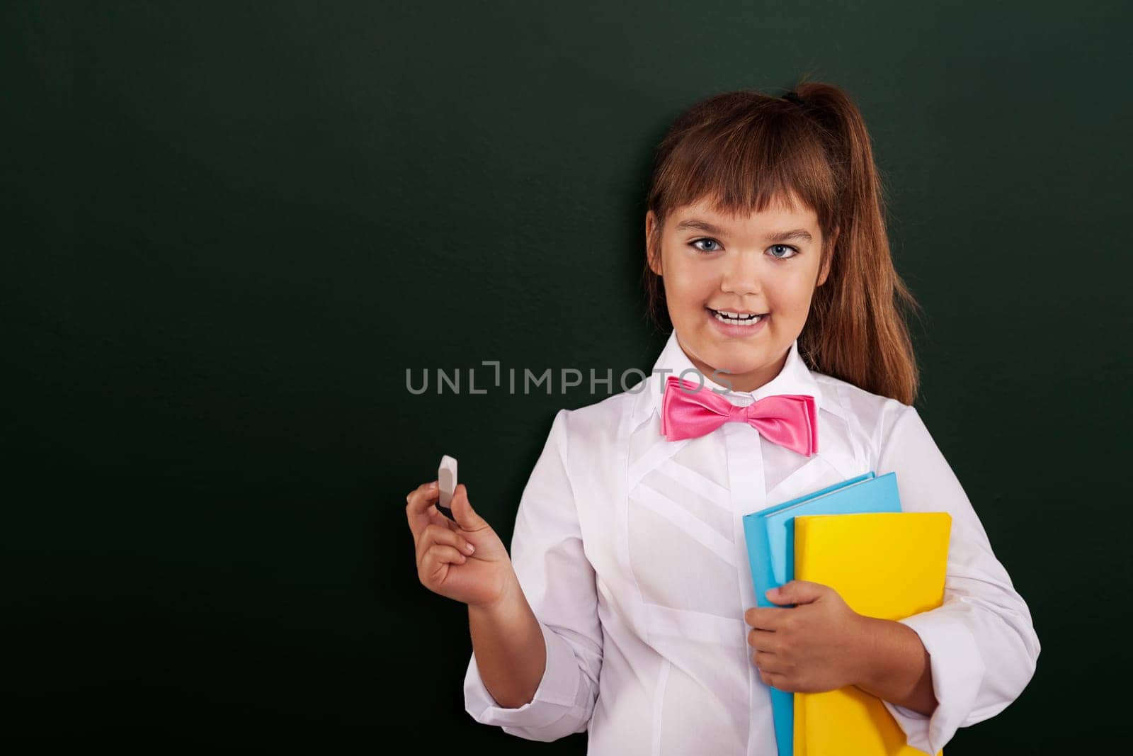 Happy little girl is ready to start lesson