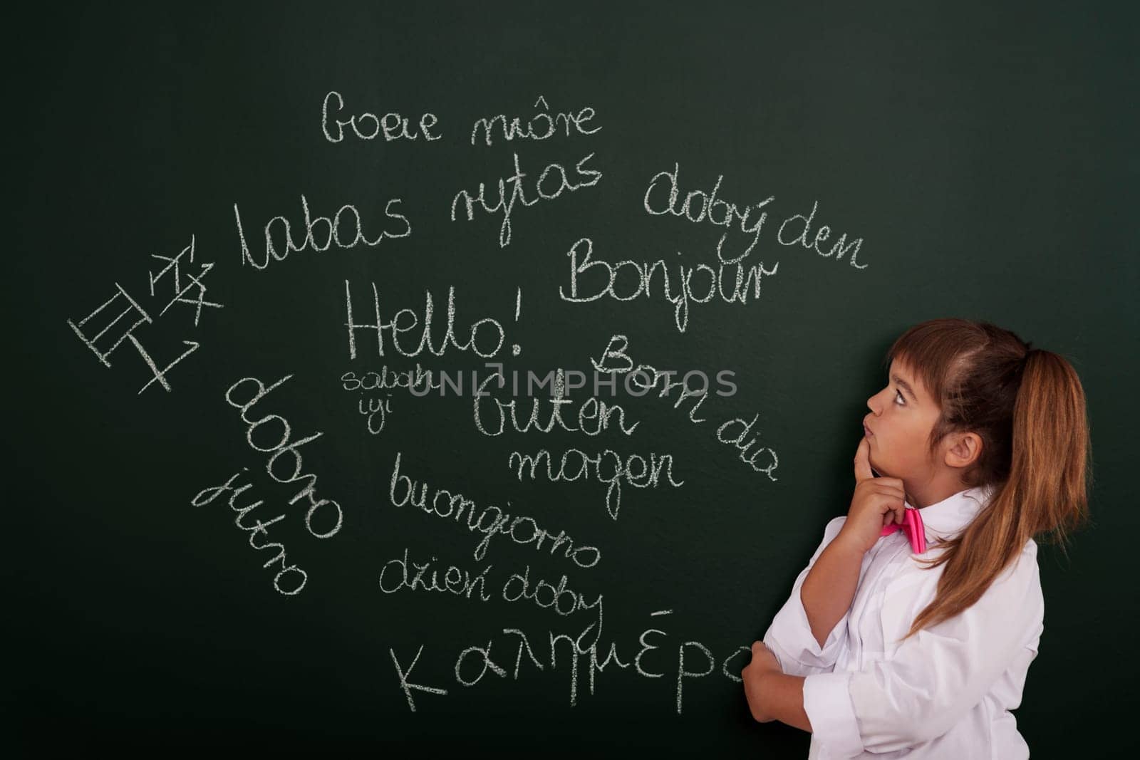 Small girl thinking about foreign phrases