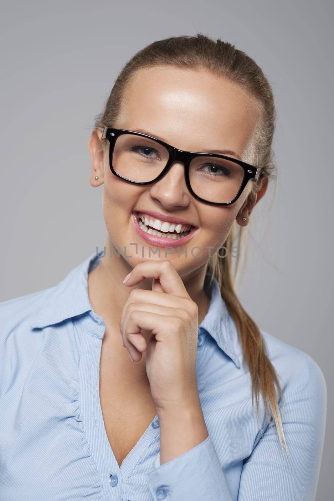 Fashionable and beautiful businesswoman in glasses