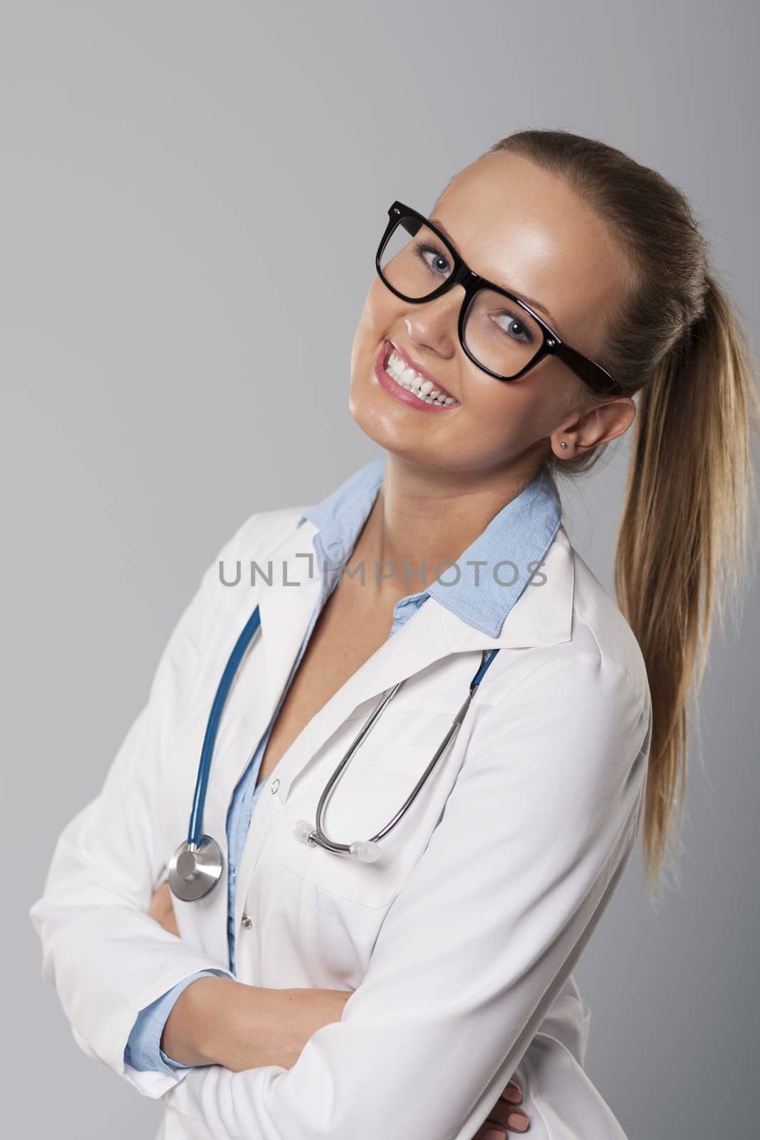 Cute young female medical student smiling