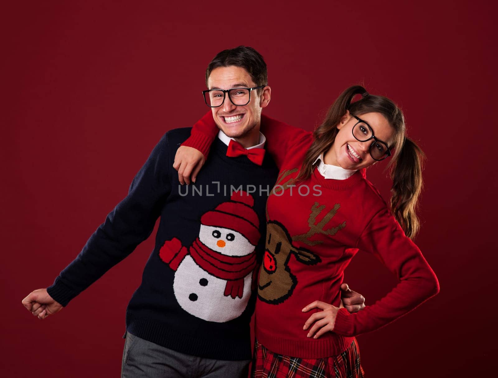 Portrait of nerd couple wearing funny sweaters