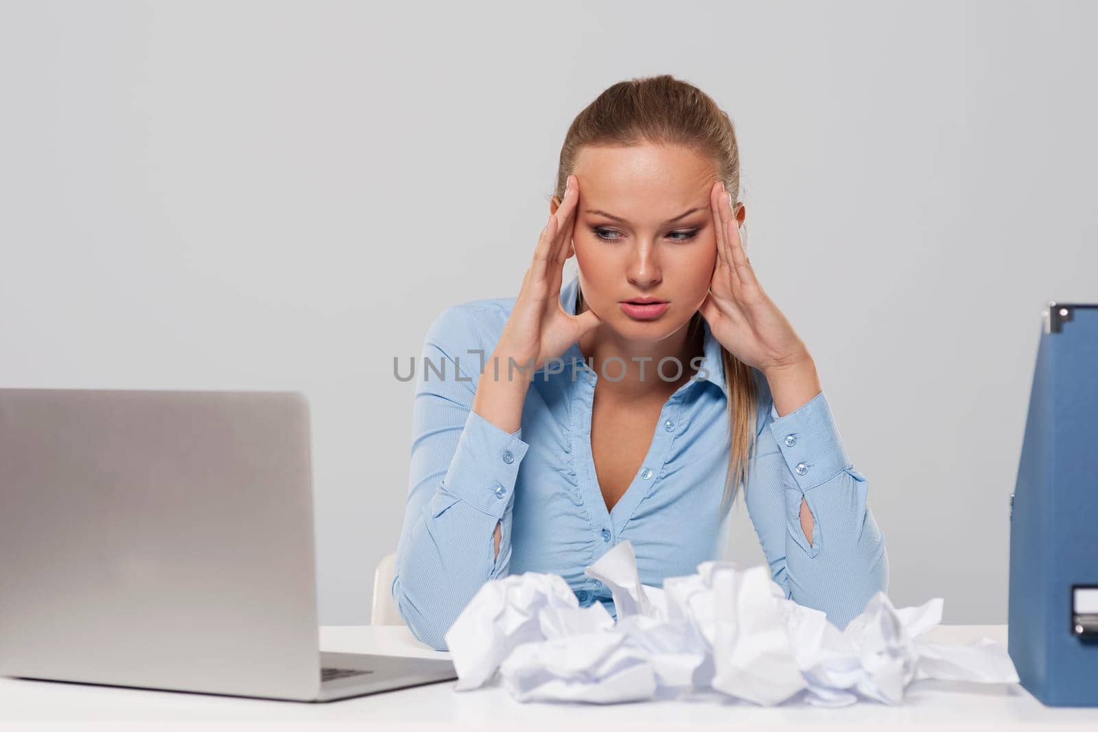 Portrait of depressed businesswoman in work
