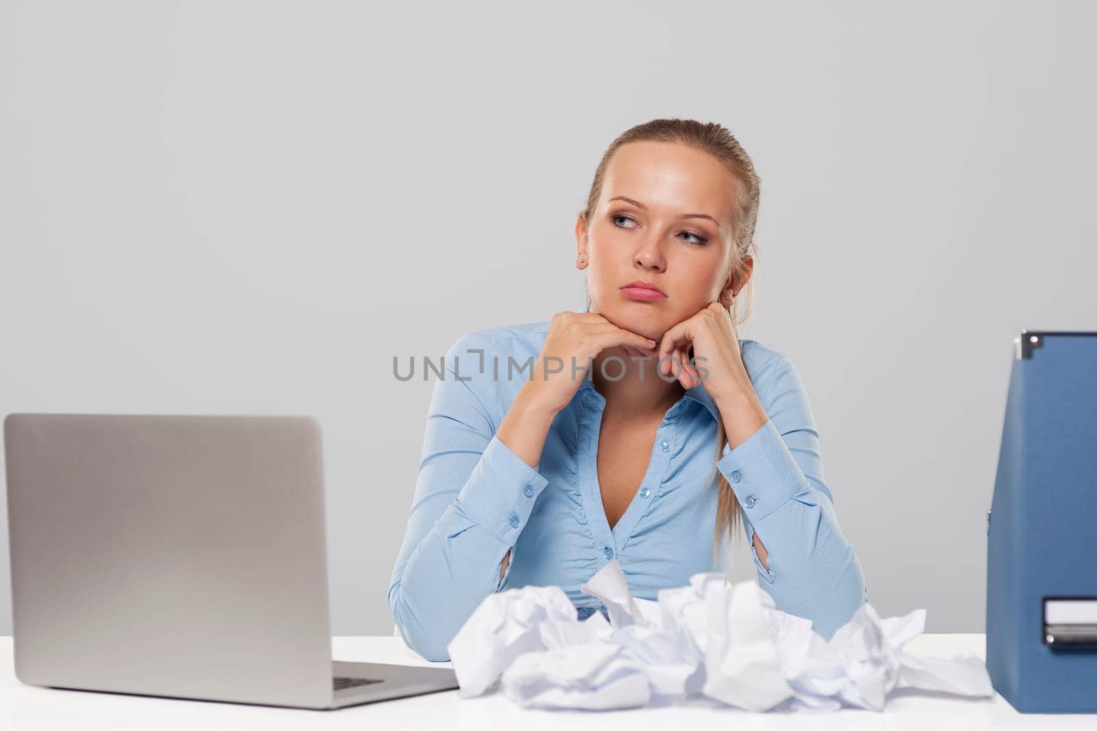Portrait of boring blonde businesswoman