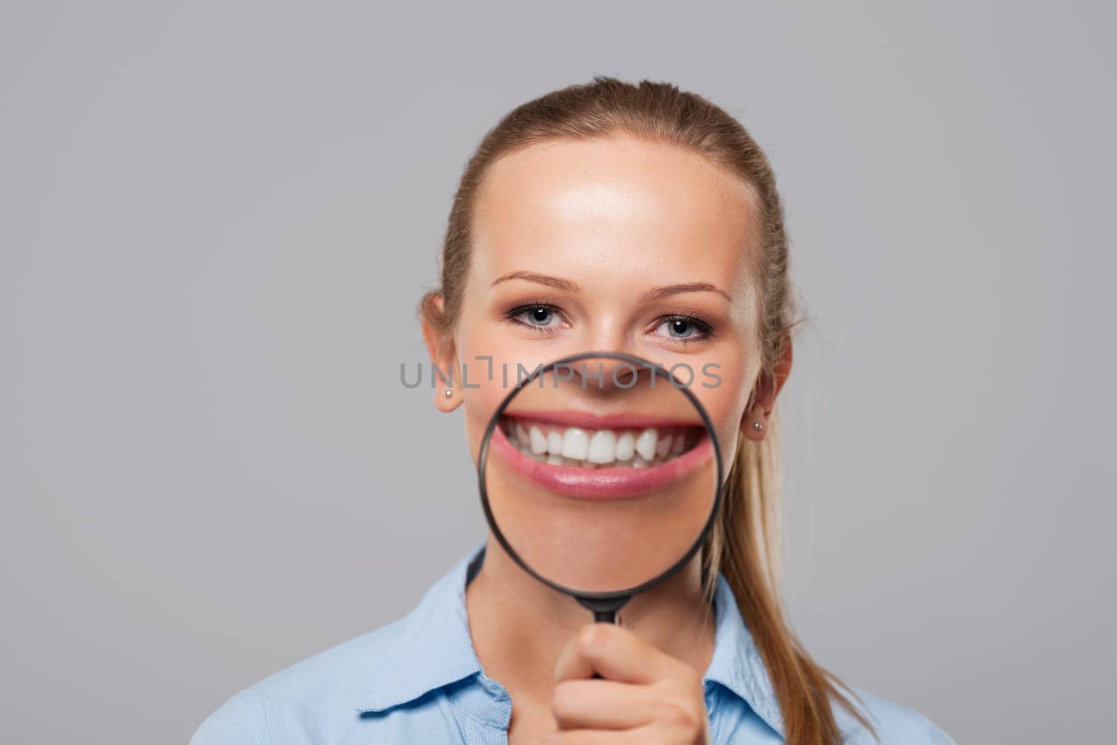 Blonde woman with big white smile