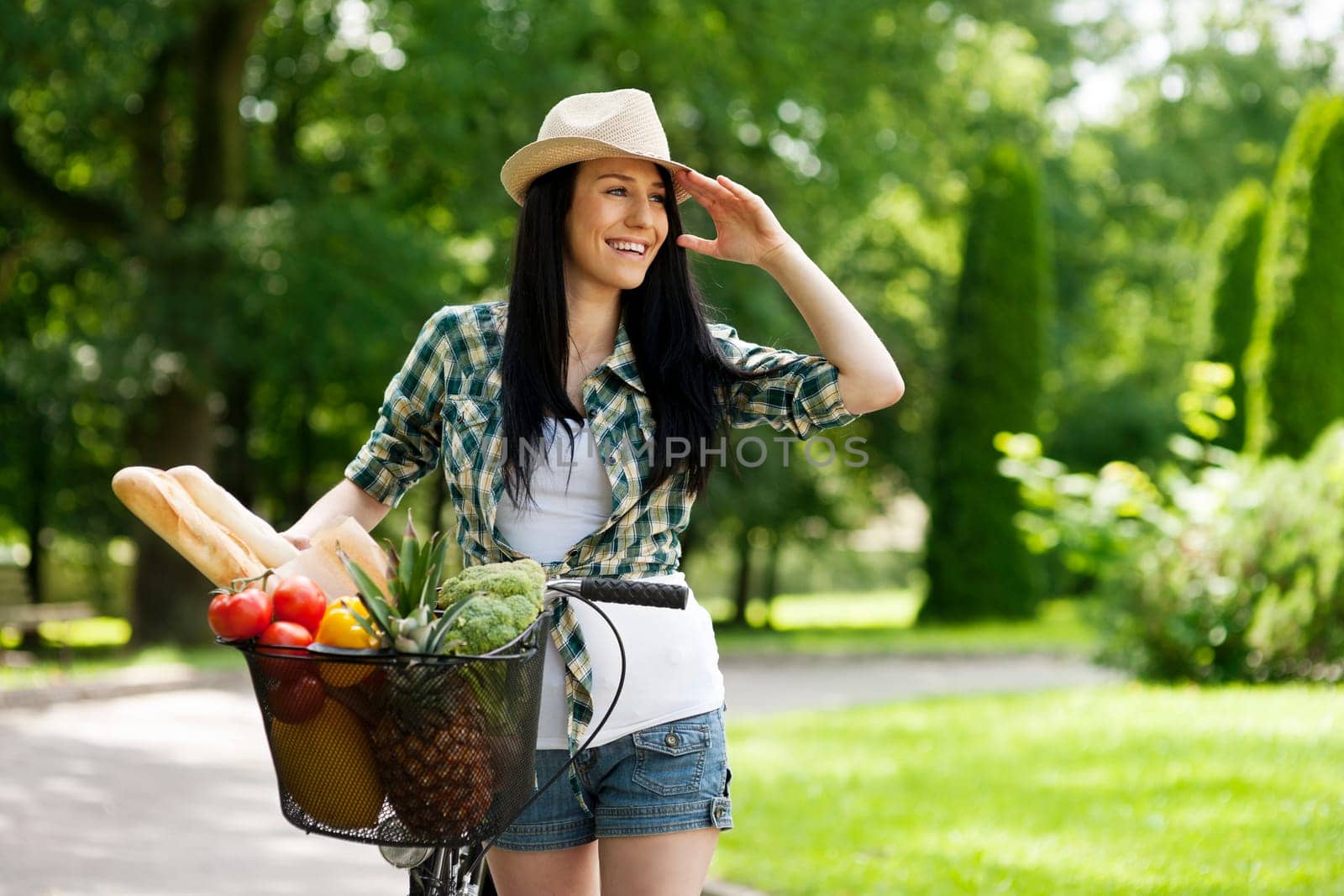 Beautiful young woman with bike