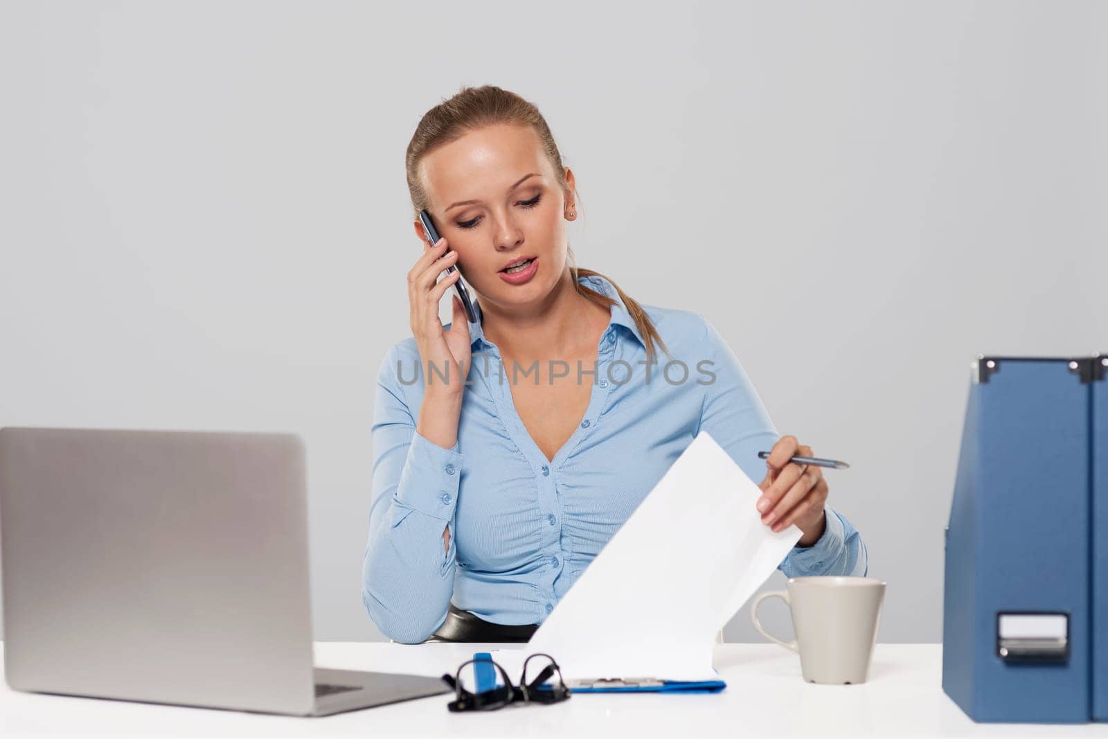 Portrait of busy young businesswoman