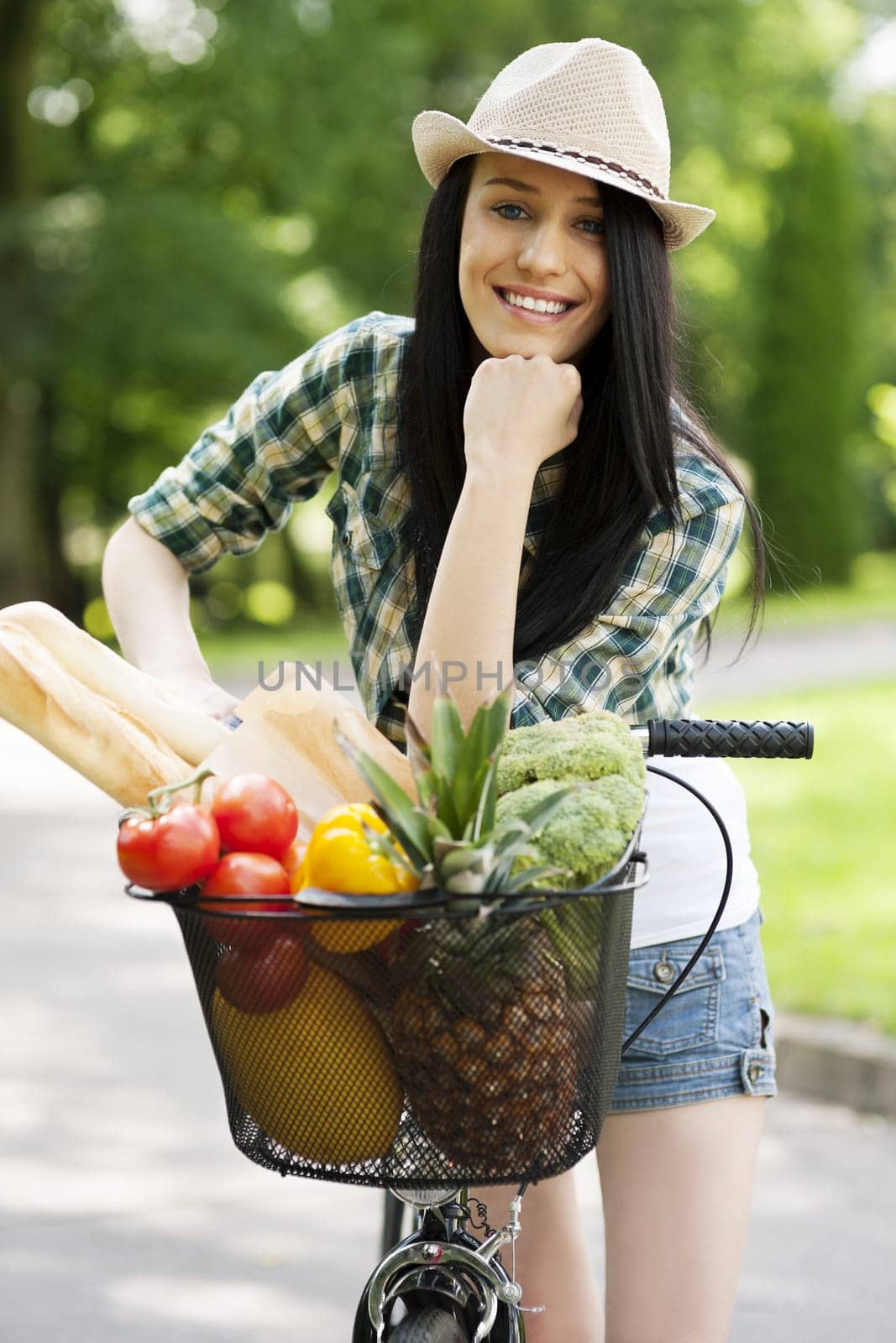 Beautiful young woman with bike