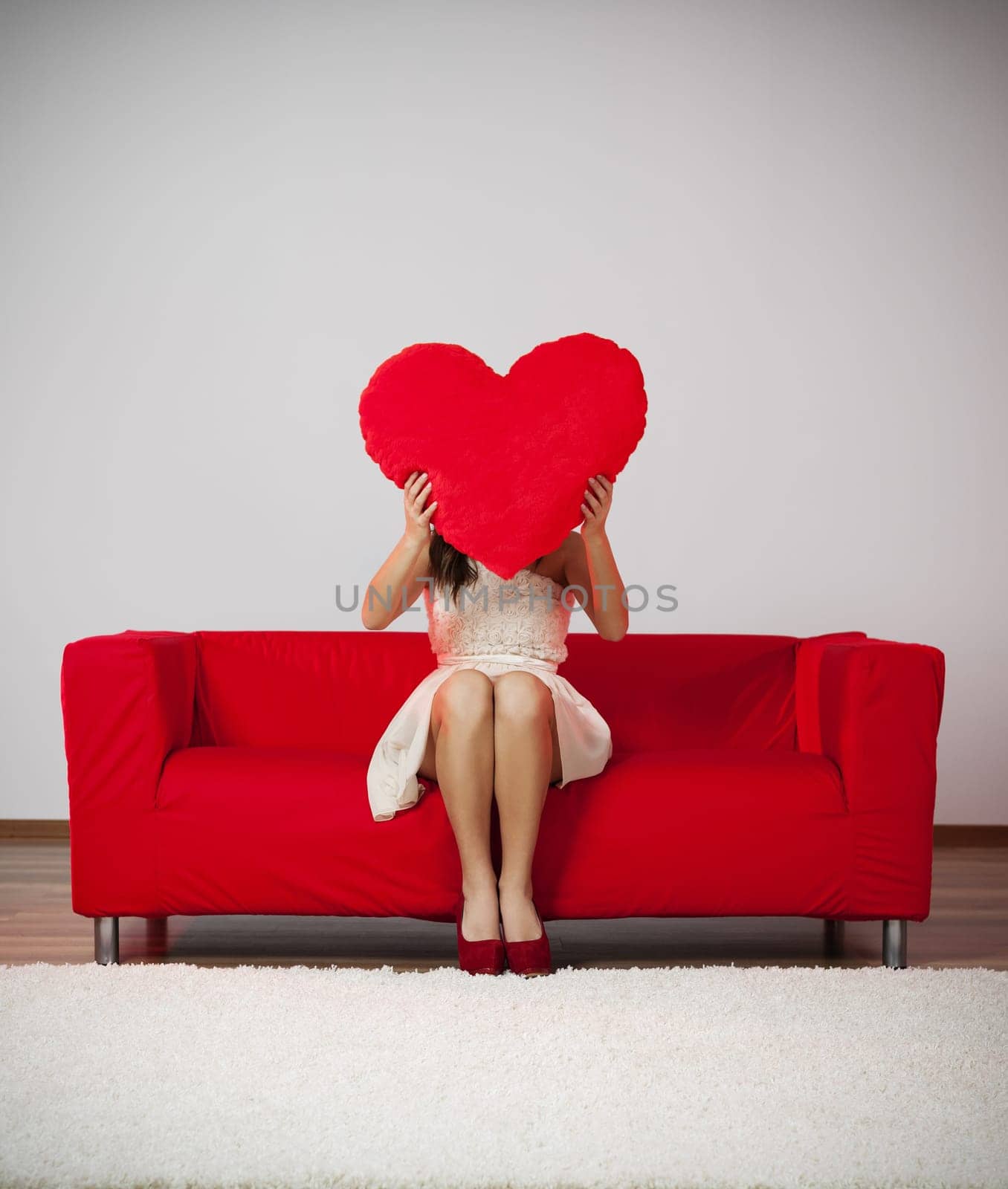 Elegant and fashion woman holding heart shape pillow