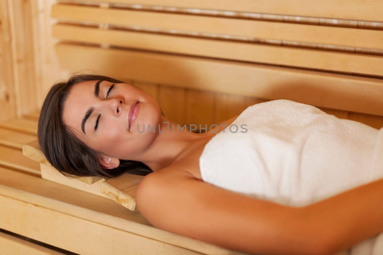 Beauty young woman resting in sauna