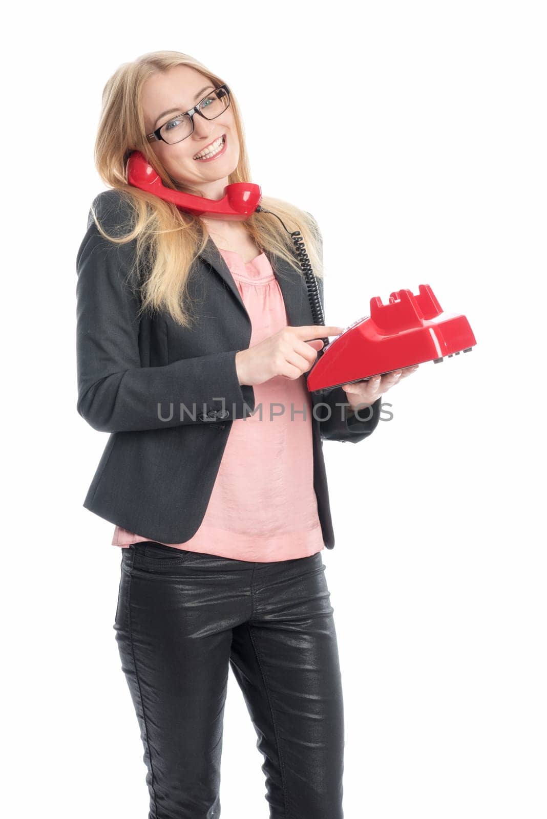 Businesswoman with red phone