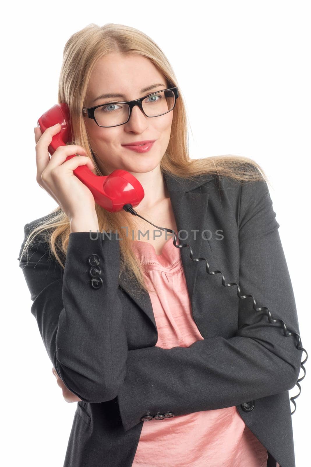 Businesswoman with red phone