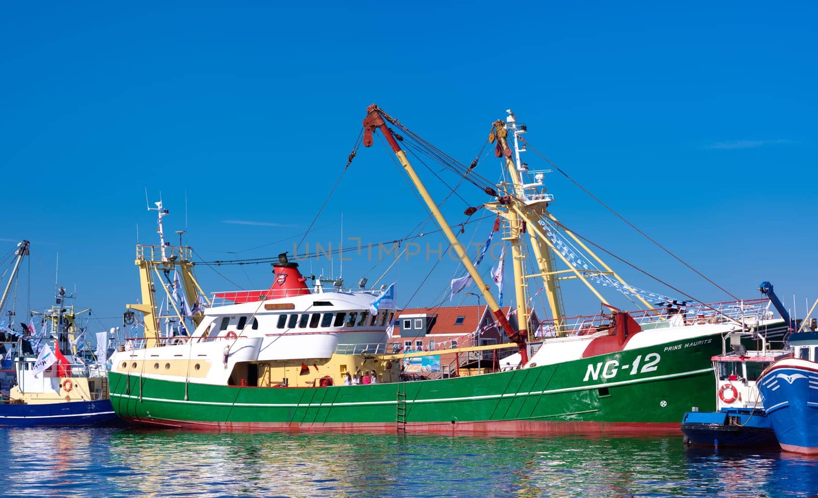 dutch fishing boats in the Urk harbor. Urk has by far the largest fishing fleet and fish processing industry in the Netherlands.