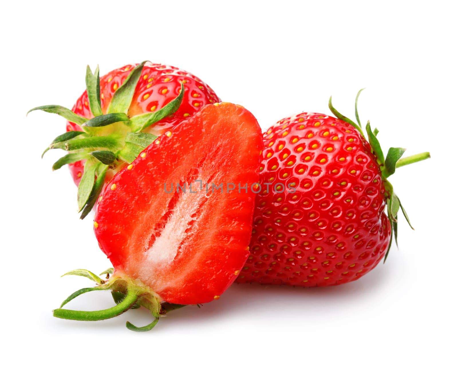 Strawberries with leaves and slices isolated on a white background