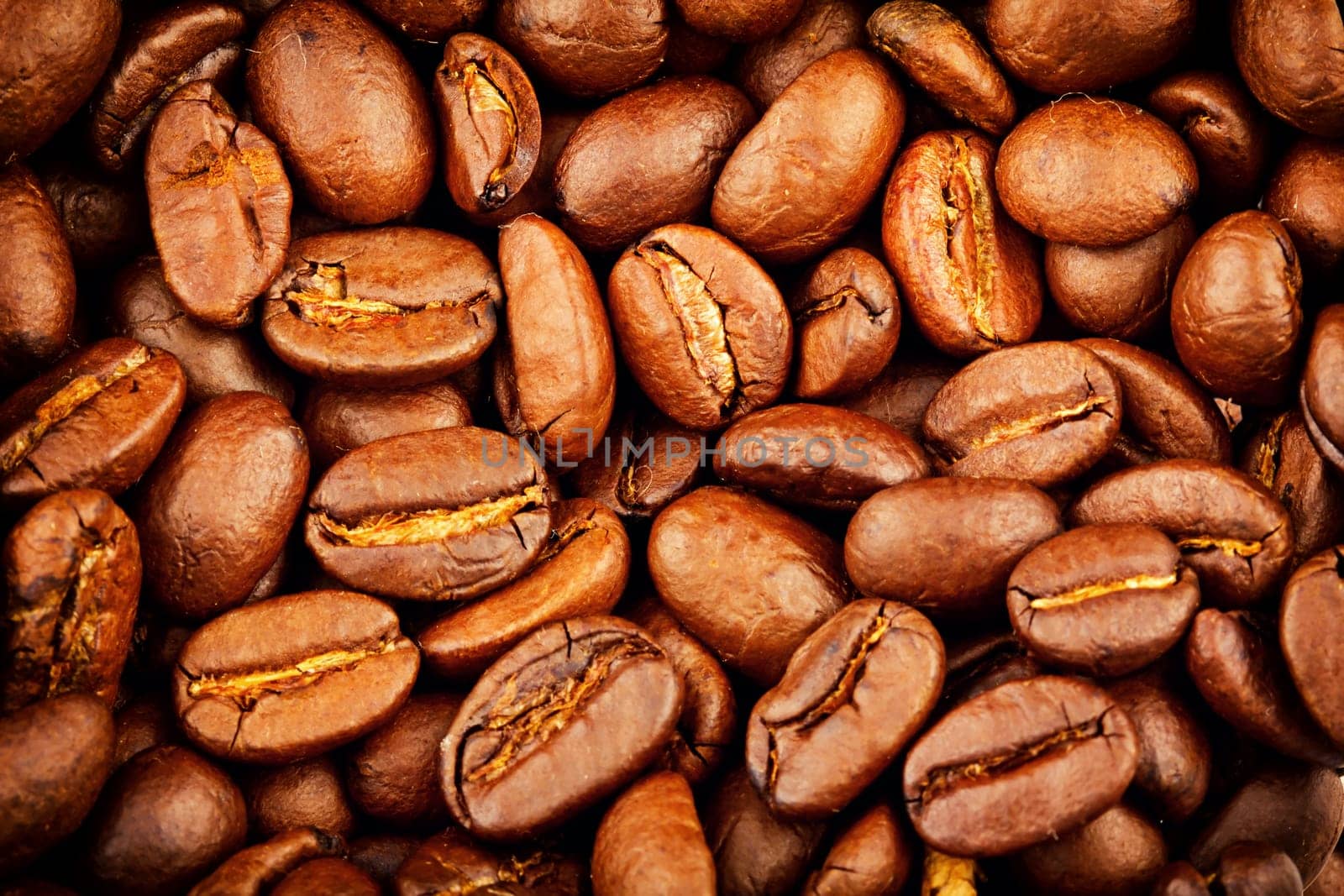 Roasted coffee beans extreme closeup background