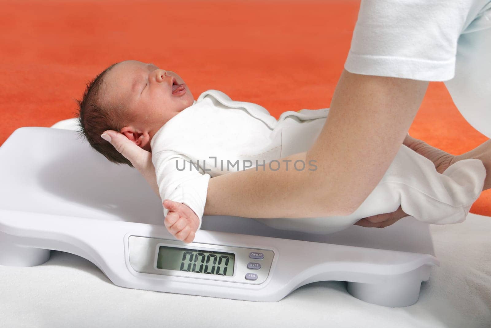 baby boy on weight scale