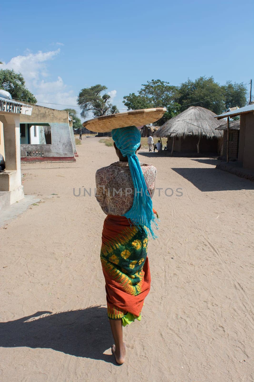 African woman with basket in head