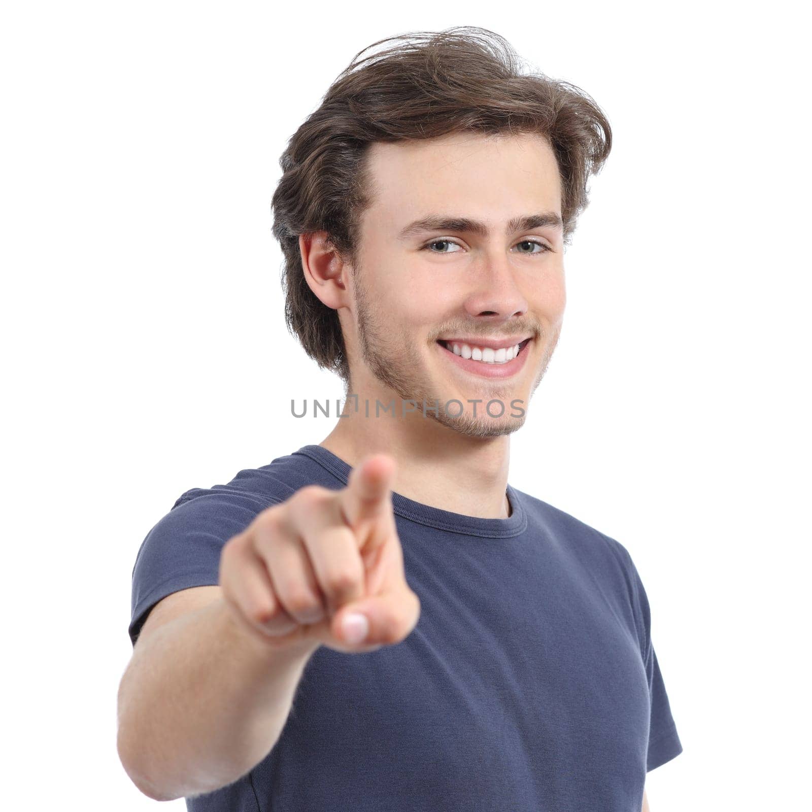 Young man with a perfect white smile pointing at camera isolated on a white background