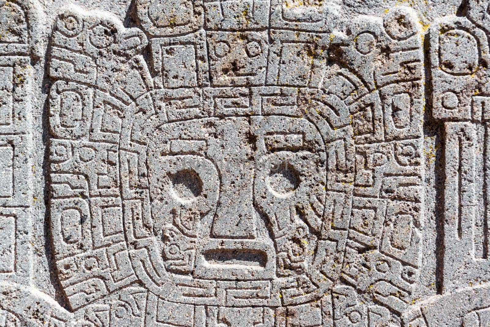 Closeup view of a face carving at the Tiwanaku ruins near La Paz, Bolivia
