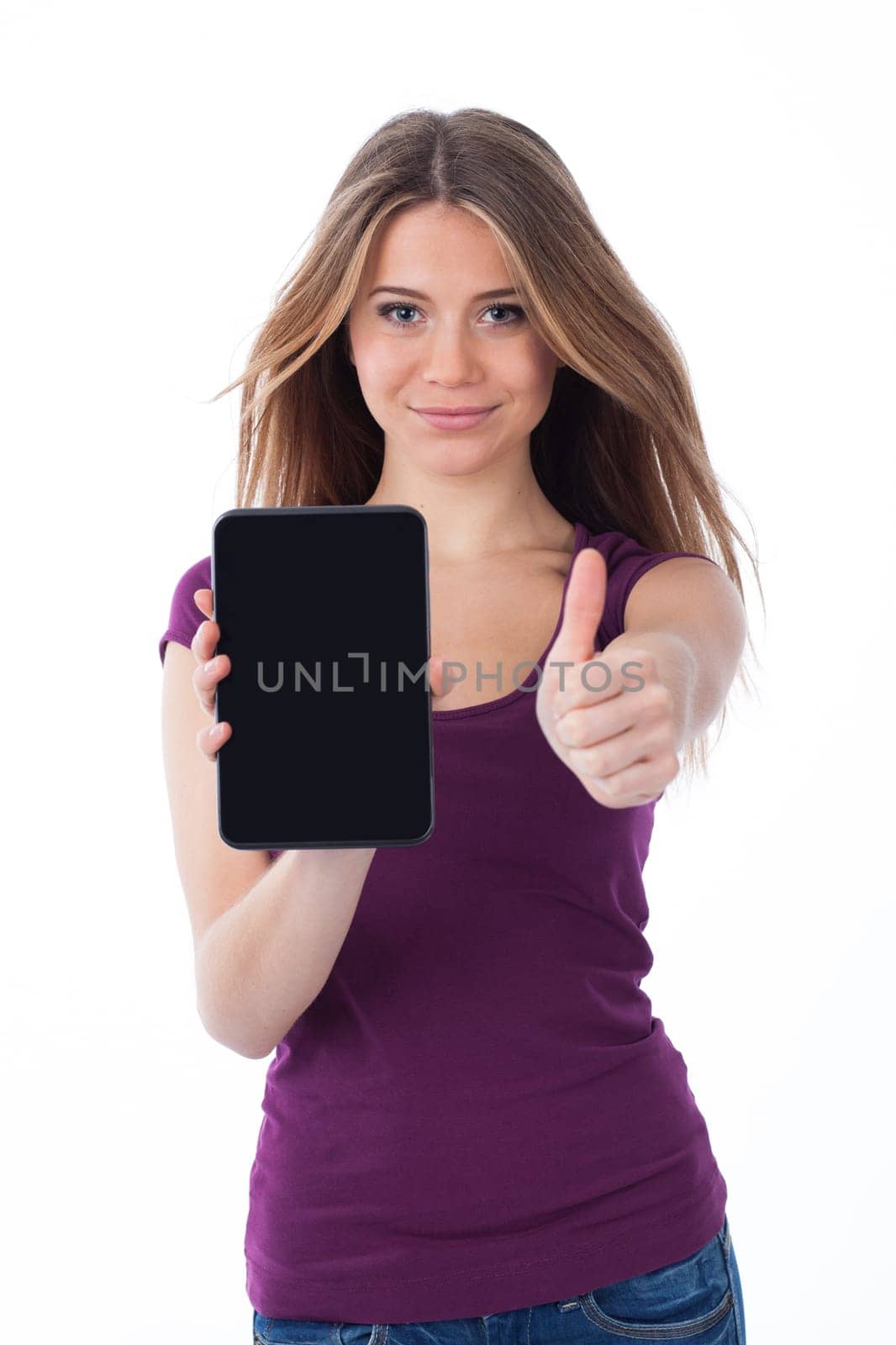 Cute woman showing an electronic tablet and having a positive gesture