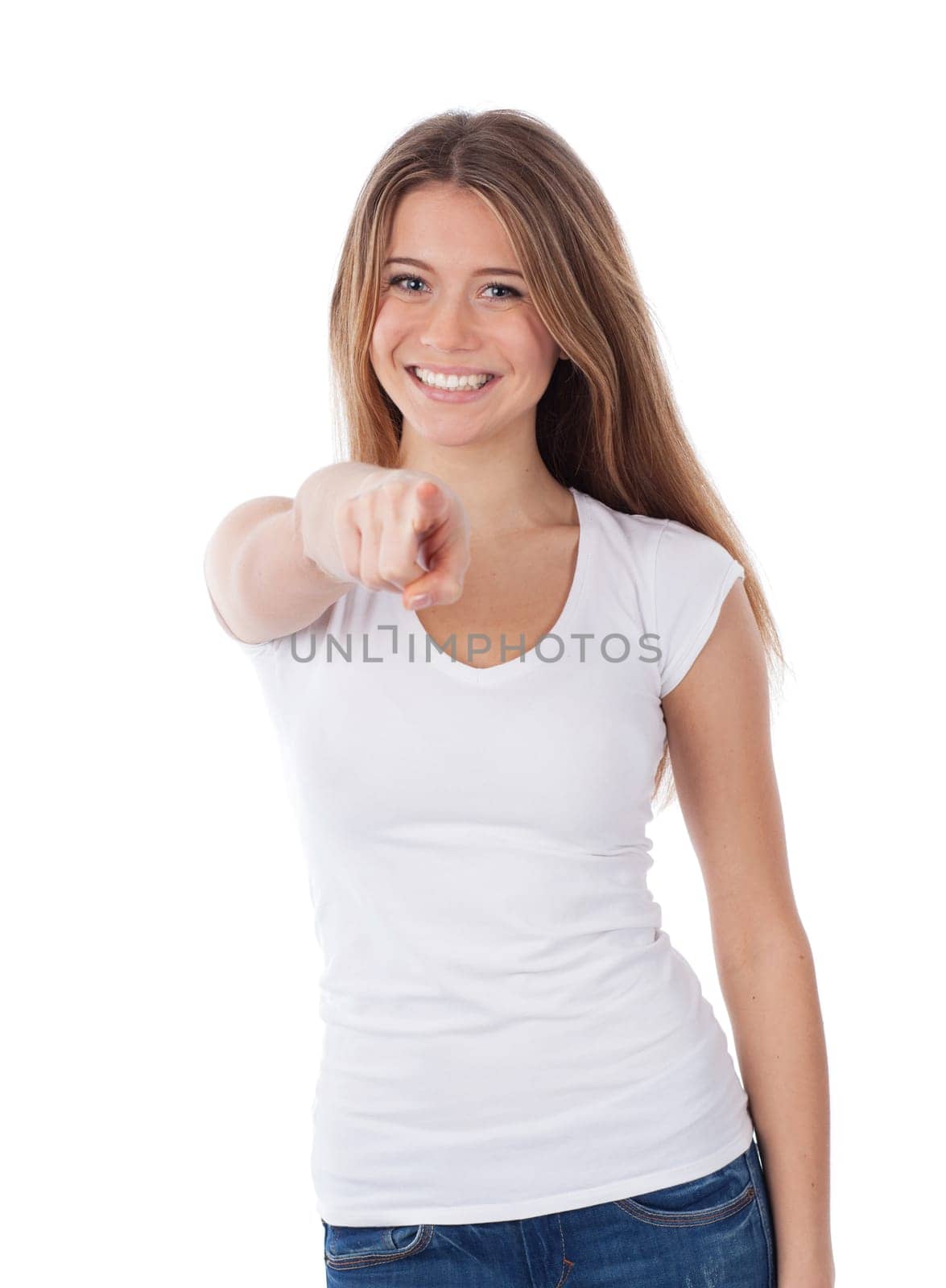 Portrait of a young woman pointing in front of her,  isolated on white