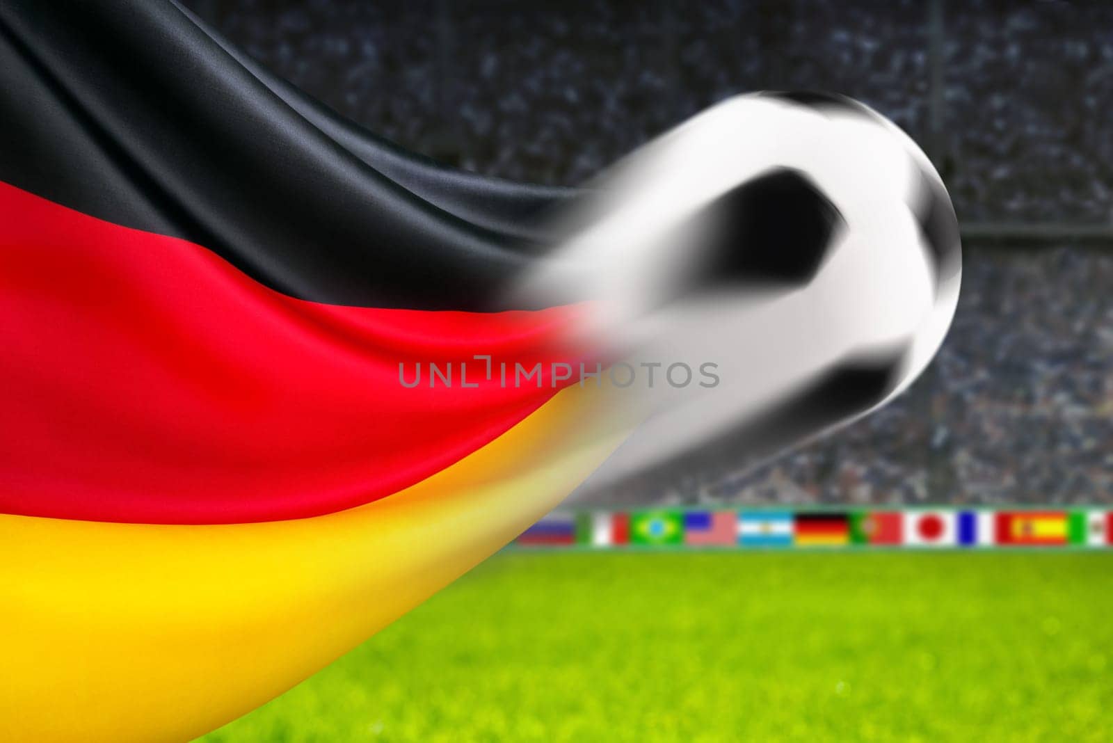 Football flies in front of waving German flag