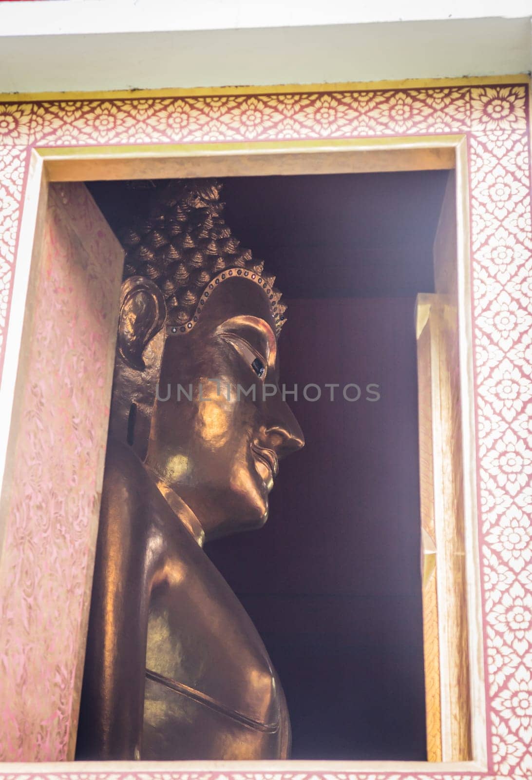 Buddha statue view from window of the temple, stock photo