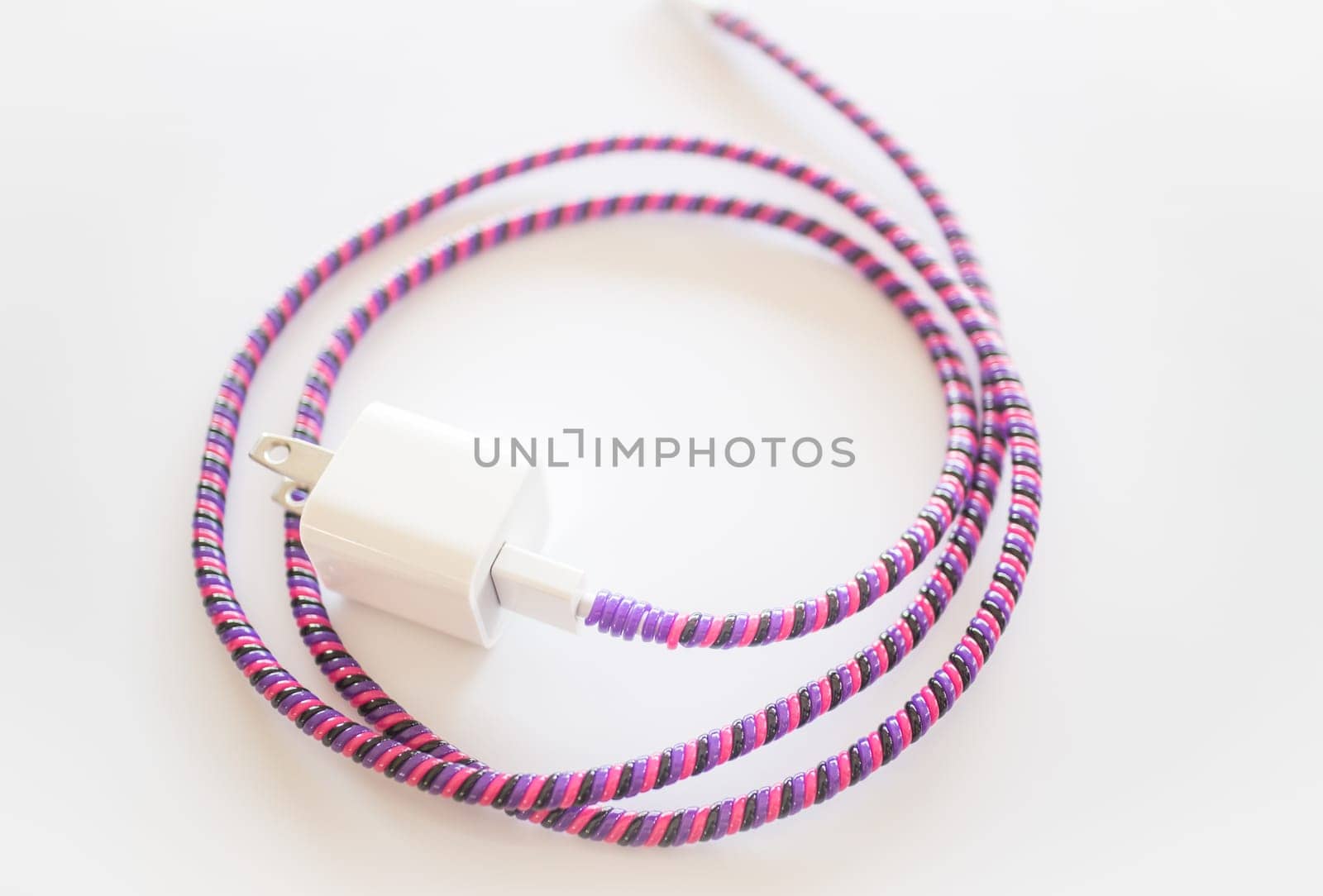 Smart phone recharging battery isolated on white background, stock photo