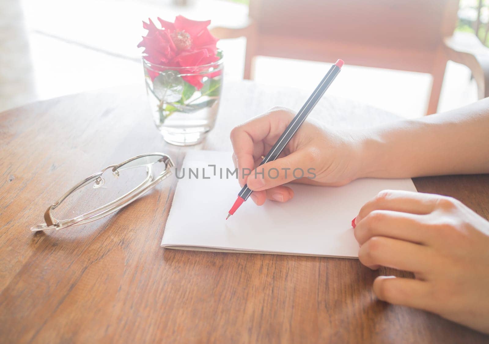 Writing love letter on romantic table, stock photo