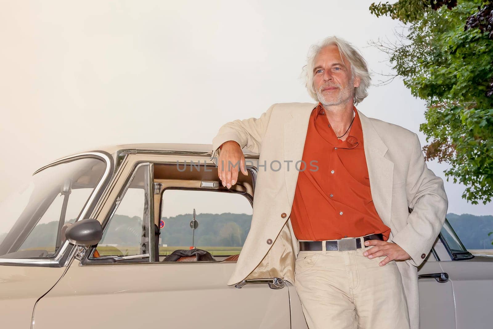 man in his car