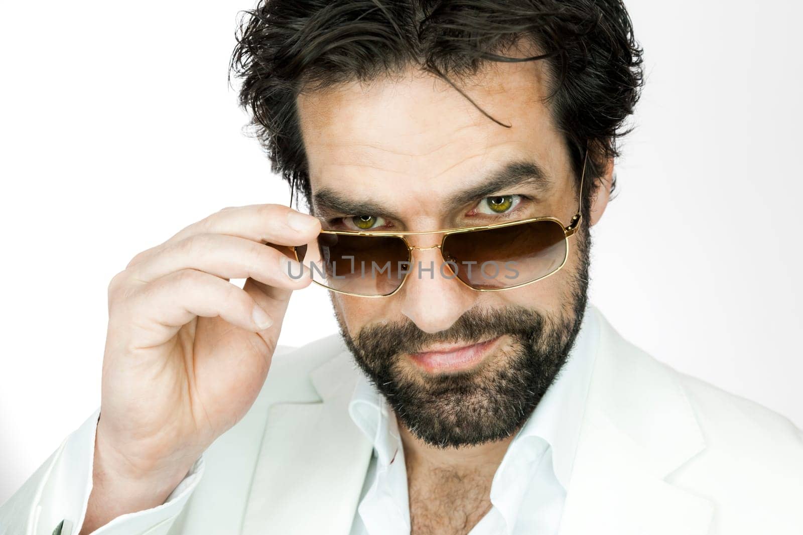 A handsome man with a beard and sun glasses