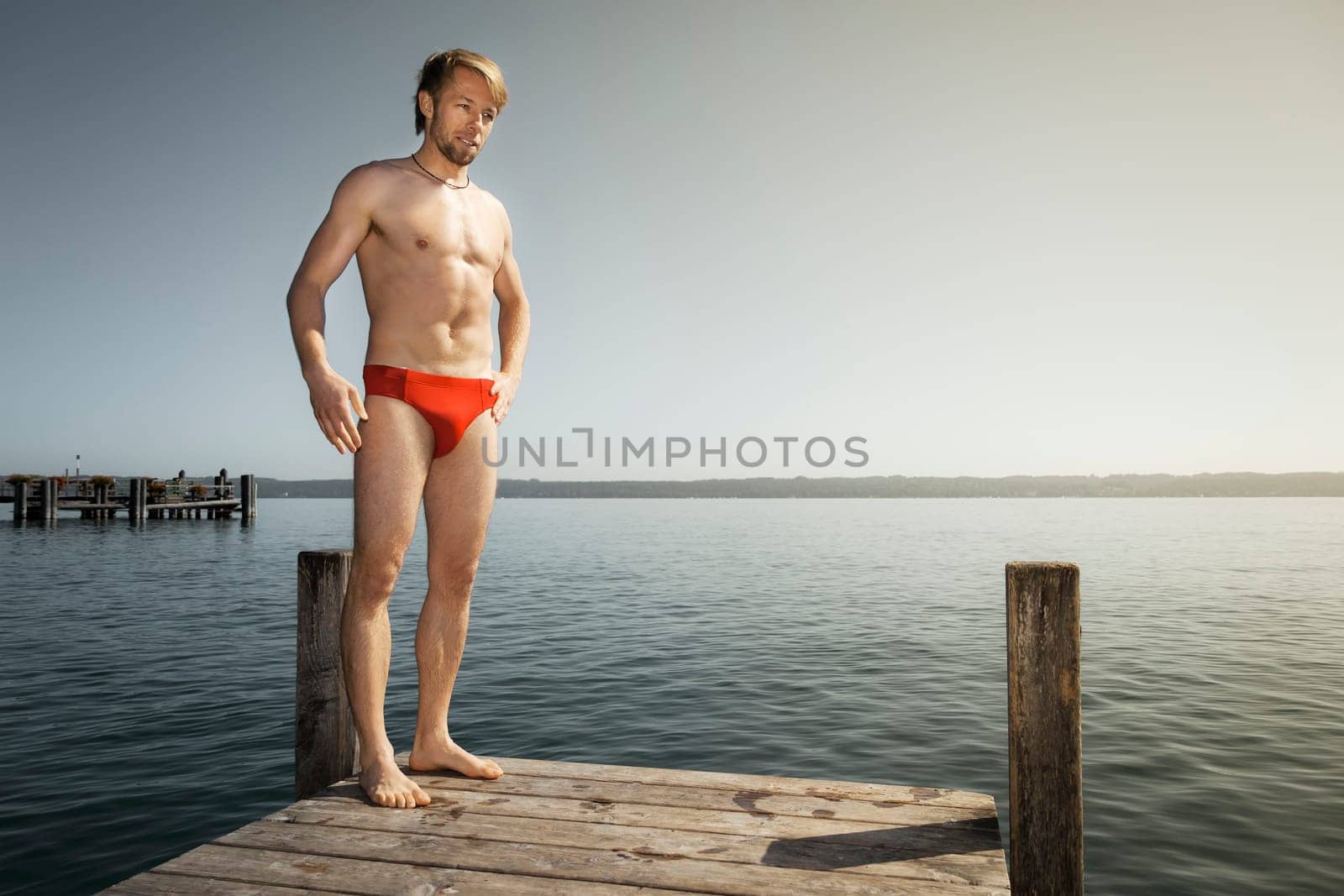 An image of a handsome man at the lake