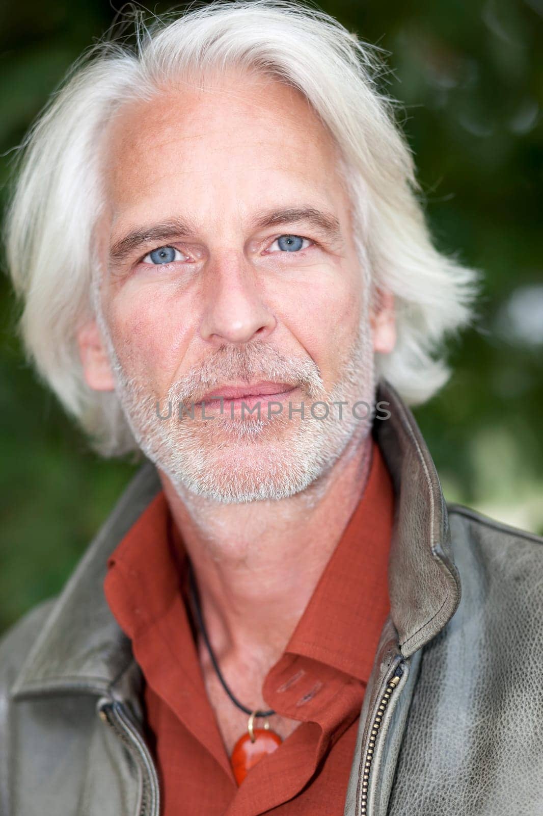 An image of a handsome male portrait with white beard