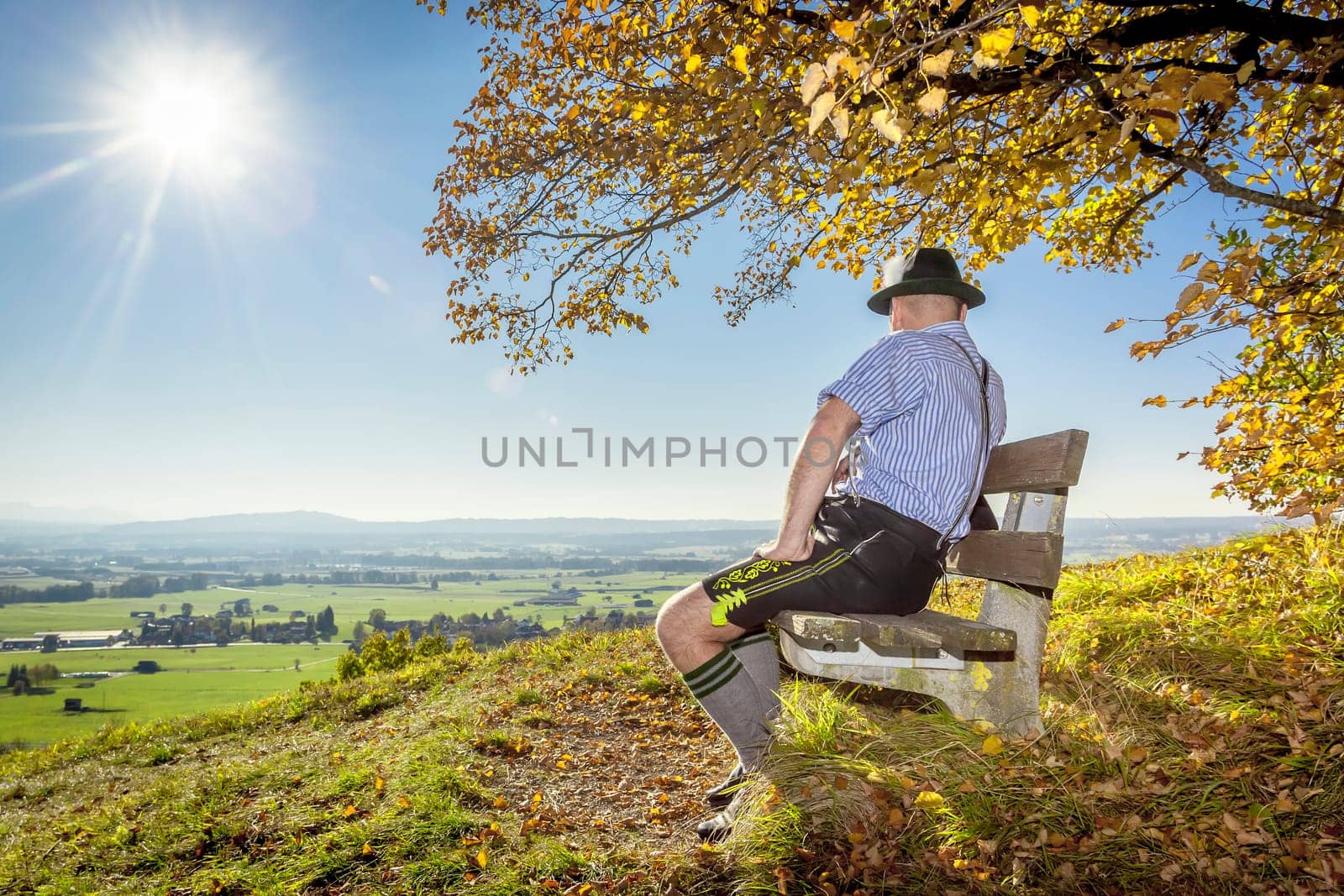 A traditional bavarian man in the autumn nature