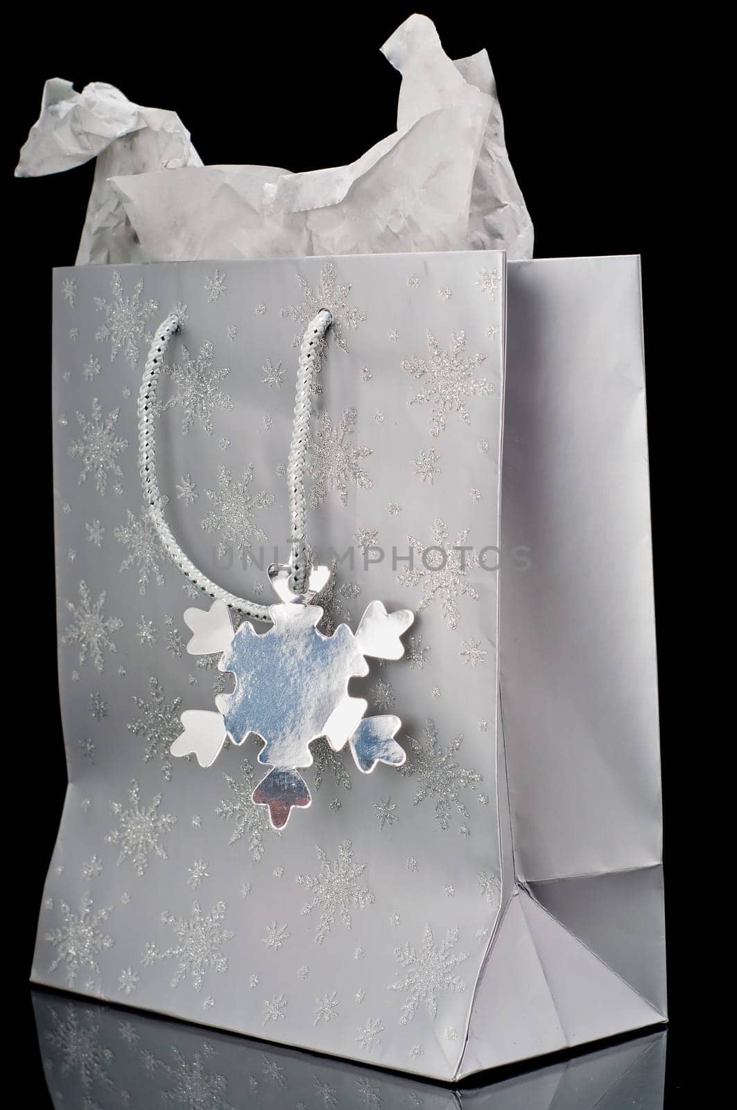 Silver gift bag on a black background