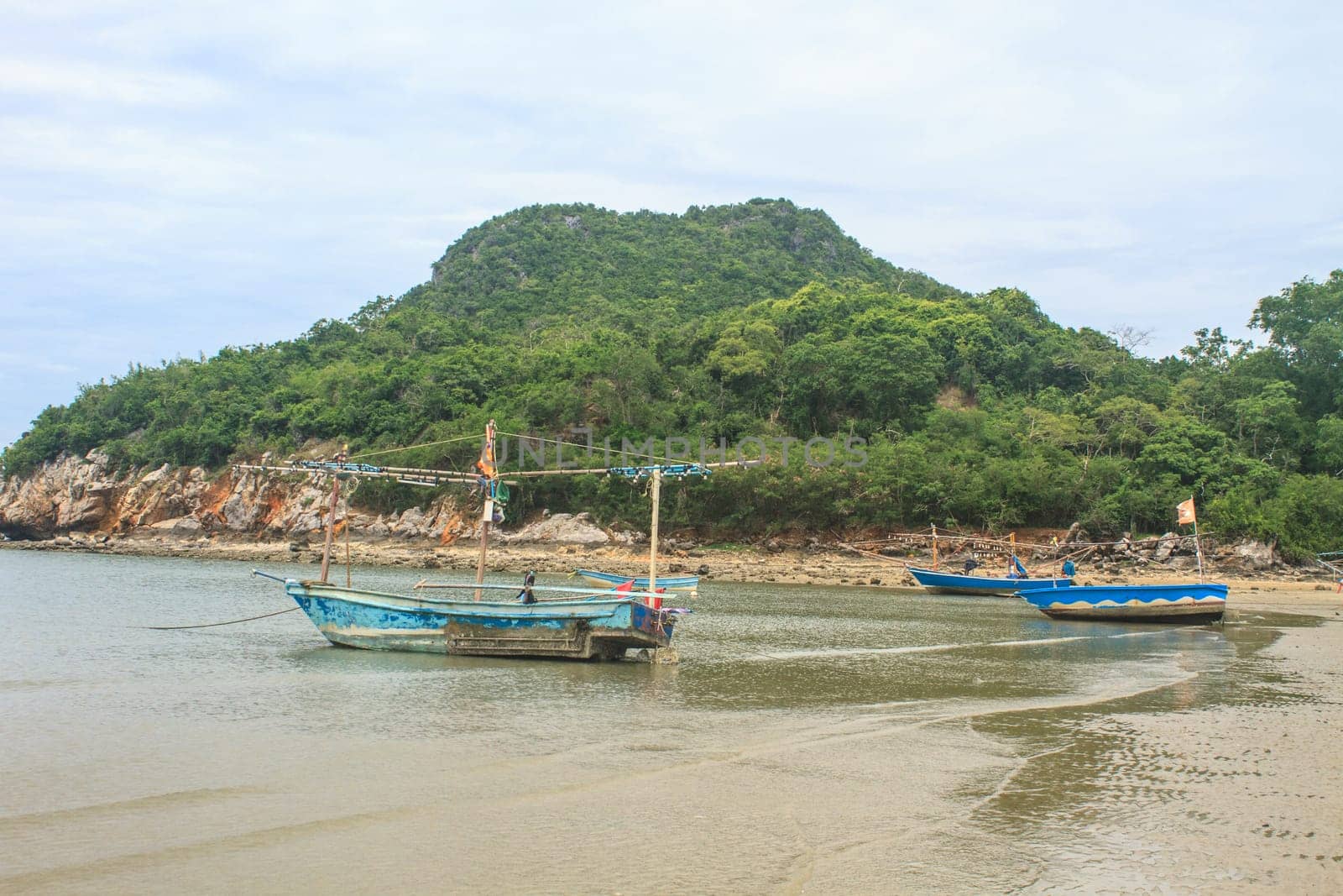 Fishing boat on the beach in summer